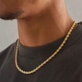 Gold finish rope chain necklace worn by man