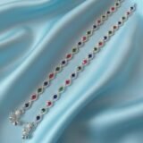 Luxury multicolor crystal silver anklet for women with red green and blue stones worn with heels