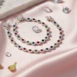 Luxury multicolor crystal silver anklet for women with red green and blue stones worn with heels