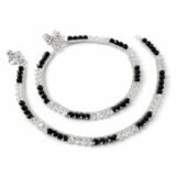 Elegant black beaded silver anklet for women with minimalist design worn on feet