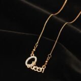 Gold Queen name pendant necklace with zircon stones and delicate chain for women