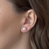 Classic white round pearl stud earrings with silver push-back closure for women