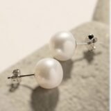Classic white round pearl stud earrings with silver push-back closure for women