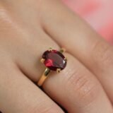 Elegant oval ruby color stone gold ring with classic prong setting for women