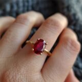 Elegant oval ruby color stone gold ring with classic prong setting for women